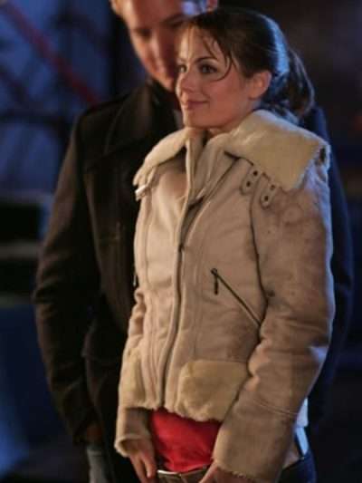 Inspired by: Erica Durance External Material: Suede Leather Inner Lining: Shearling Lining Front: Zipper Closure Collar: Shearling Collar Color: Beige Pockets: Two at Front and One Inside Sleeves: Full-length Sleeves